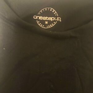 One step up… black tank top